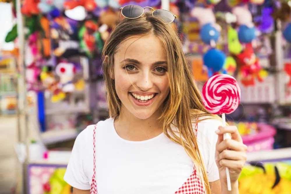 young-woman-showing-red-lollipop